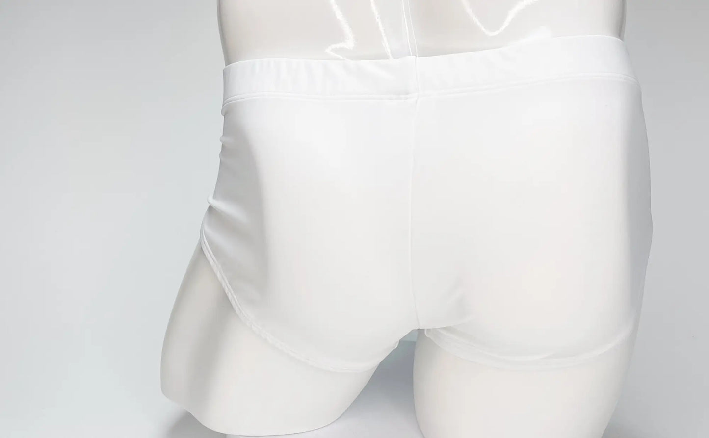 Wildmant big boy pouch swim brief in white with a glossy finish and smooth elastic waistband for comfortable wear