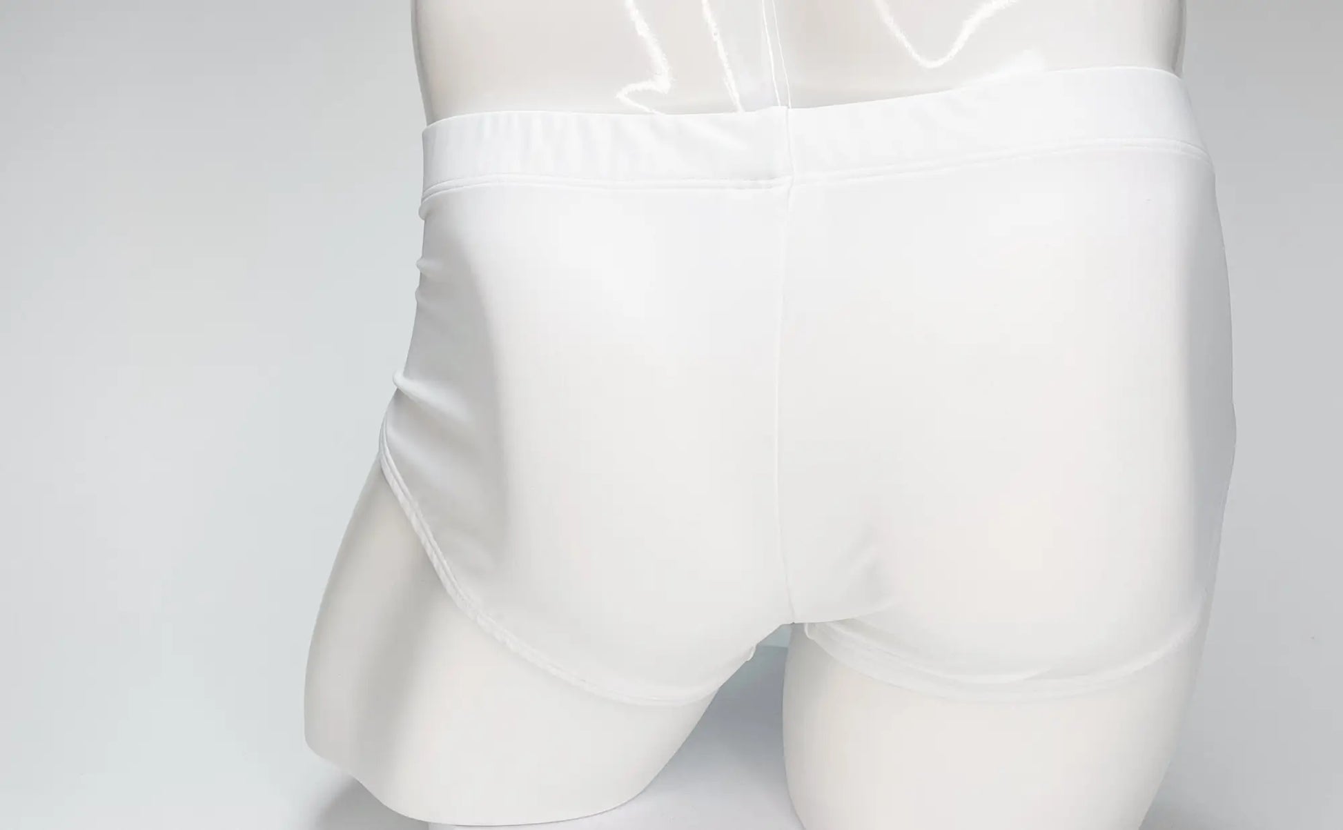 Wildmant big boy pouch swim brief in white with a glossy finish and smooth elastic waistband for comfortable wear
