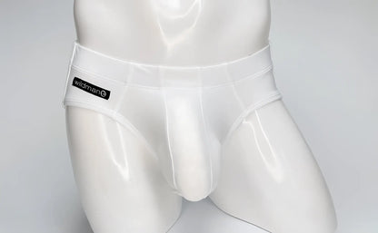 WildmanT white Big Boy pouch swim brief on a mannequin, featuring a black branded logo patch on the right hip.