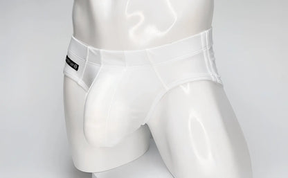 White WildmanT swim brief with a large contoured front pouch, worn by a mannequin, featuring a black side logo tag.