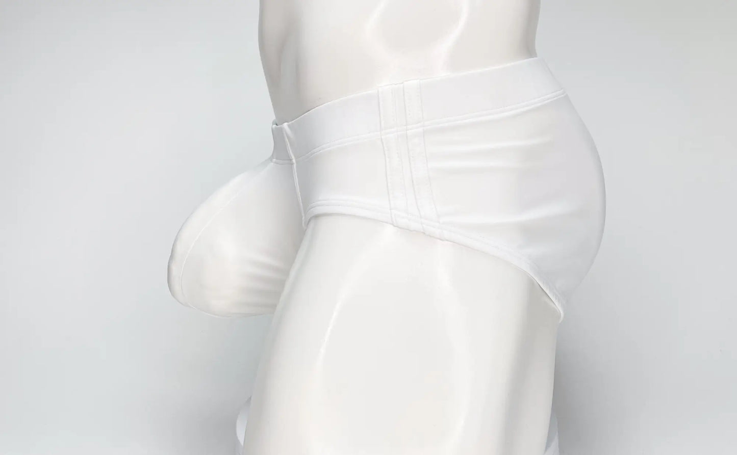 Wildmant big boy pouch swim brief in white satin with smooth glossy finish and tailored fit front view