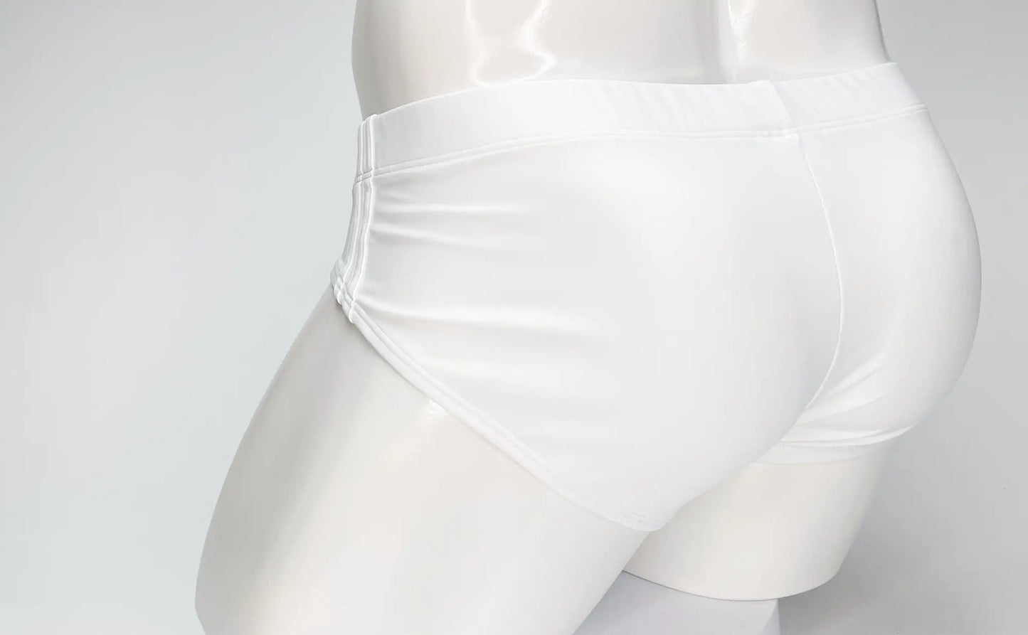 WildmanT big boy pouch swim brief in white satin with smooth glossy finish and clean stitching