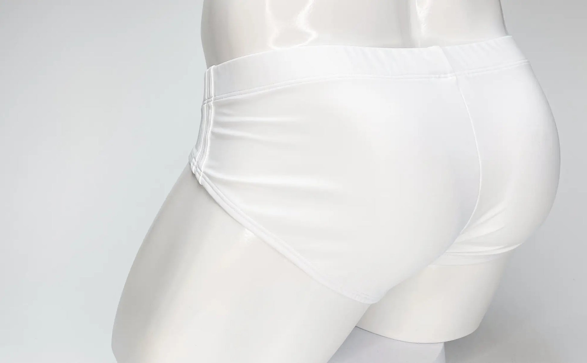 WildmanT big boy pouch swim brief in white satin with smooth glossy finish and clean stitching