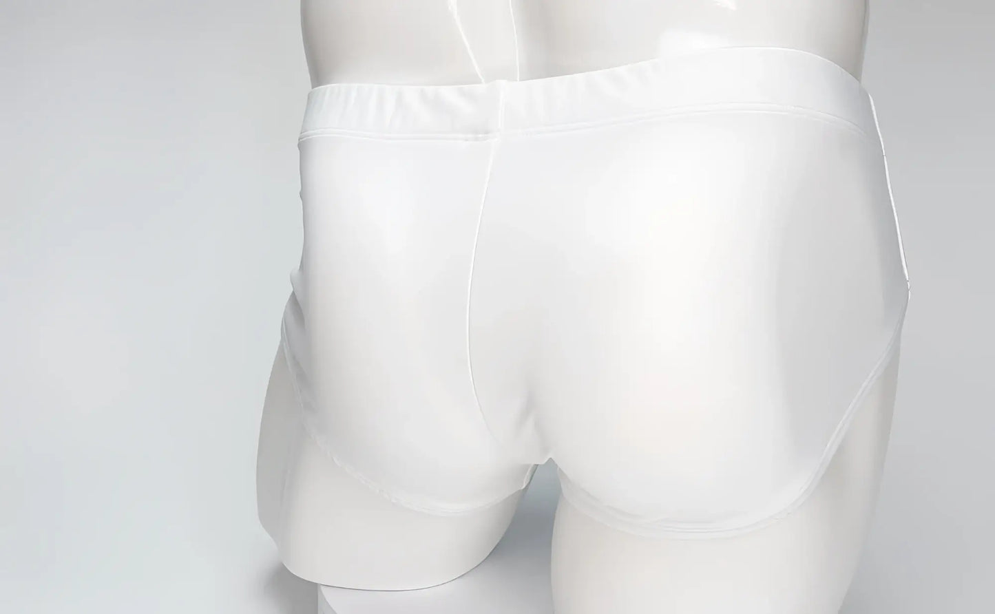 Back view of white WildmanT Big Boy Pouch swim brief on a mannequin against a plain light background.