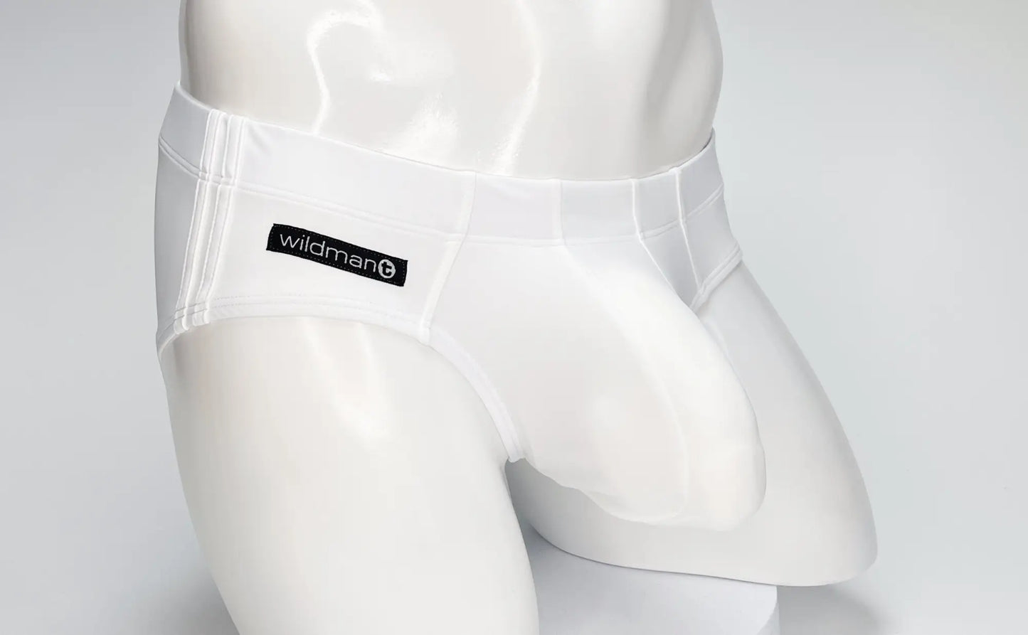 White wildman brand briefs with sleek form-fitting design and smooth fabric from the wildmant big boy pouch swim brief white line