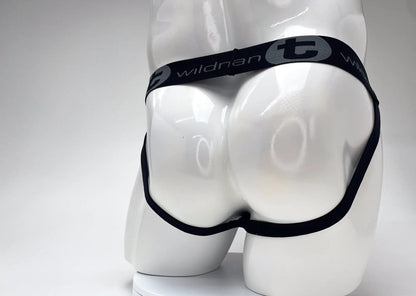 Black elastic waistband with wildnan branding on white mannequin for wildmant cotton big boy pouch stripe jockstrap red black