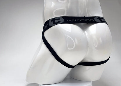 Black elastic waistband with wildman branding on a white mannequin wearing wildmant cotton big boy pouch stripe jockstrap red black
