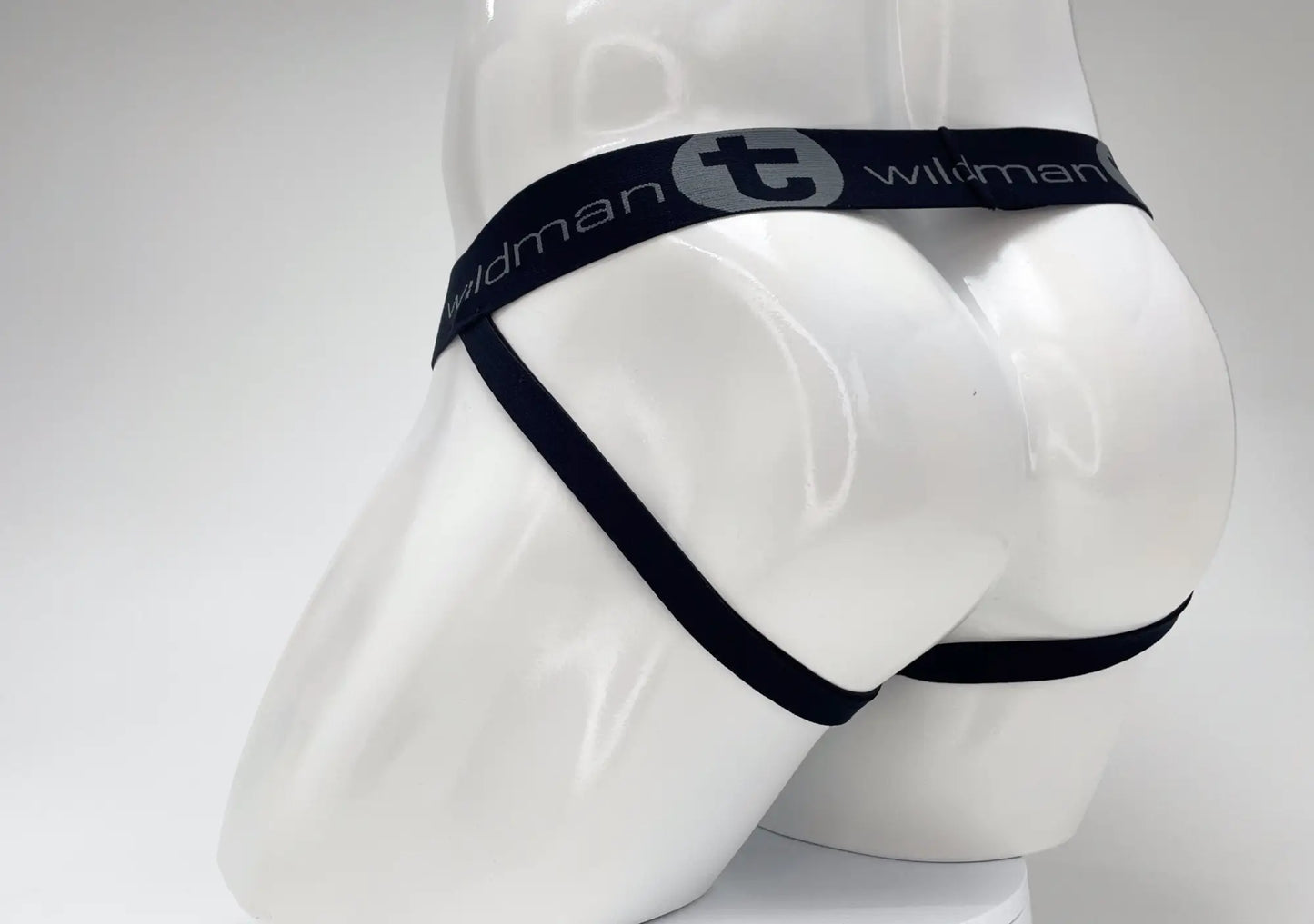 Black elastic waistband with wildman branding on a white mannequin wearing wildmant cotton big boy pouch stripe jockstrap royal blue baby blue