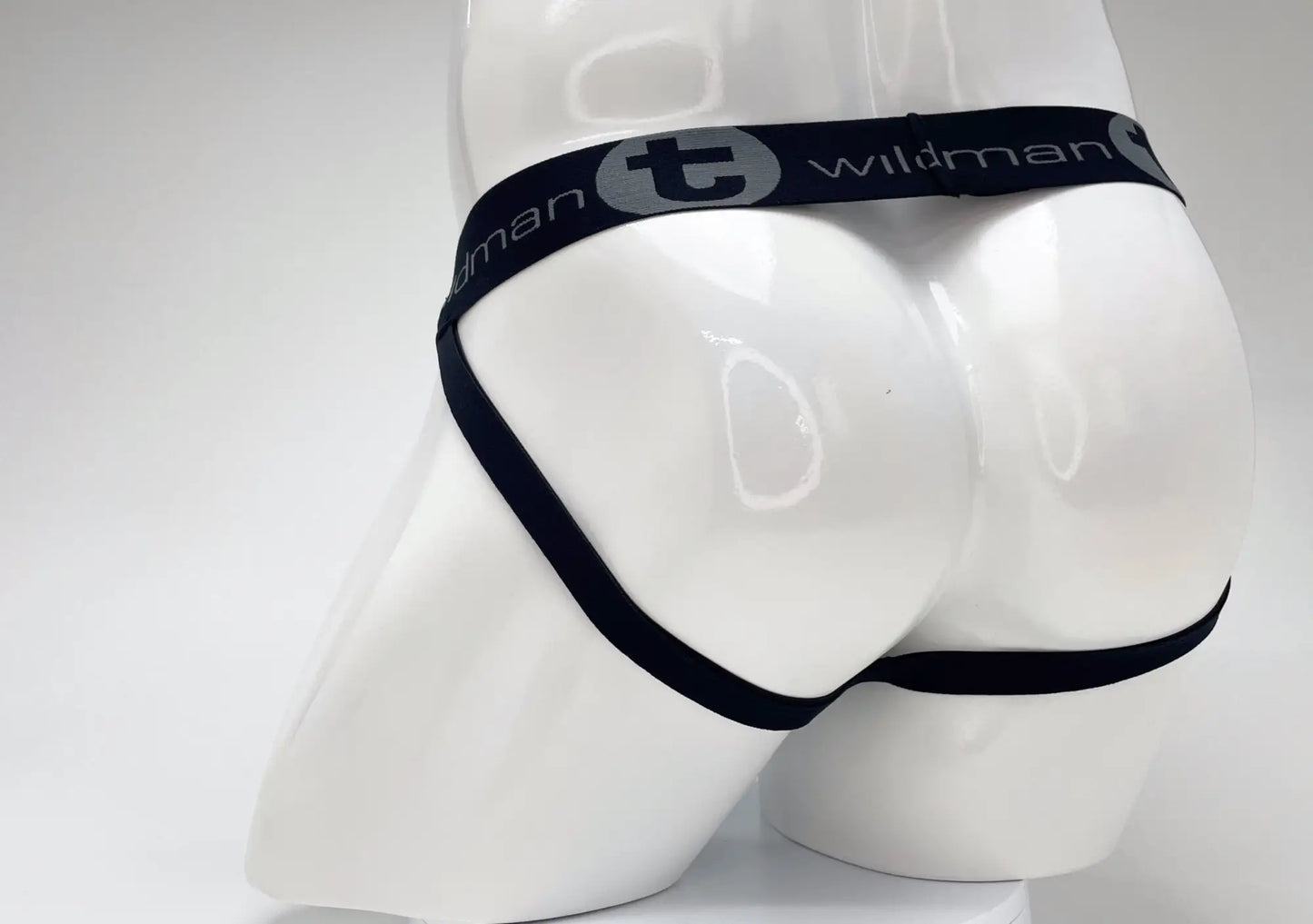 Black elastic waistband with wildman branding on a white mannequin for wildmant cotton big boy pouch stripe jockstrap royal blue baby blue