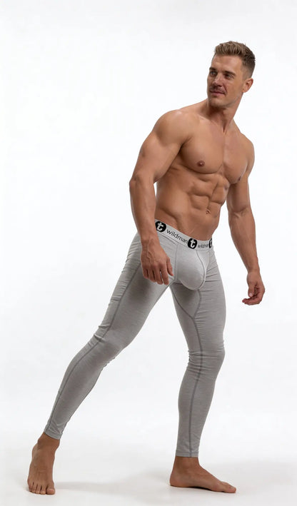 Muscular man wearing grey cotton long johns with a prominent "Big Boy" contour pouch and branded black waistband.