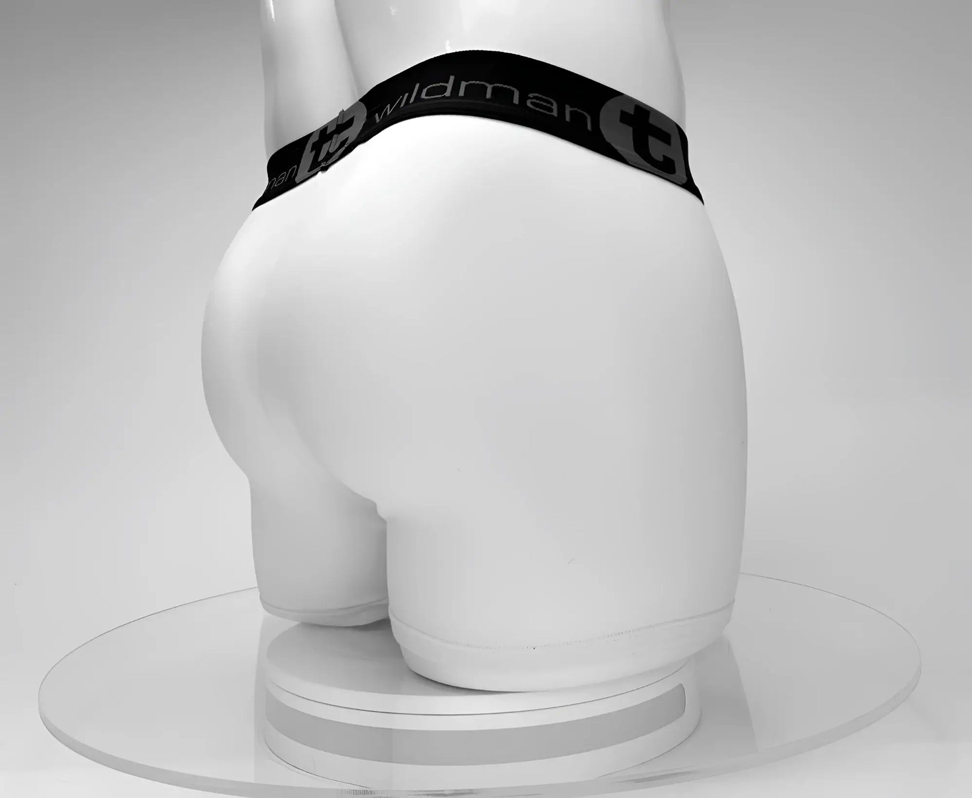 White cotton wildman boxer briefs with black elastic waistband and circular emblem featuring wildman logo