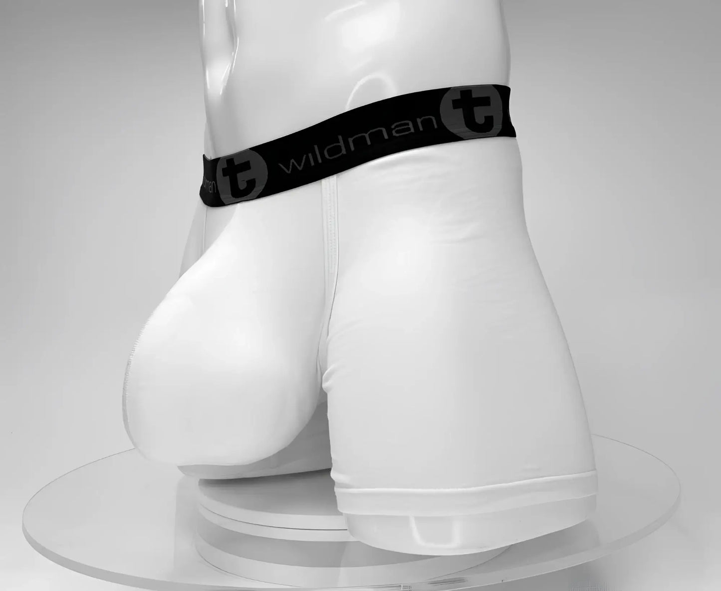 White wildmant cotton boxer briefs with 5 inch inseam black waistband featuring wildman logo and circular t emblem