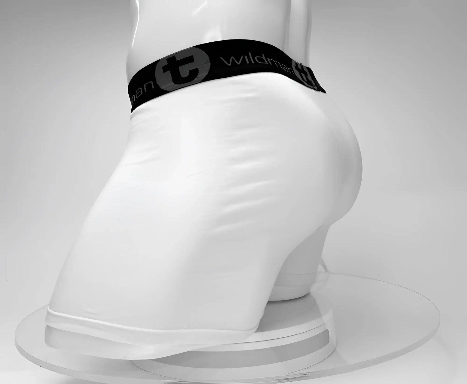 White men’s cotton boxer briefs with a 5 inch inseam and black wildman waistband featuring the logo