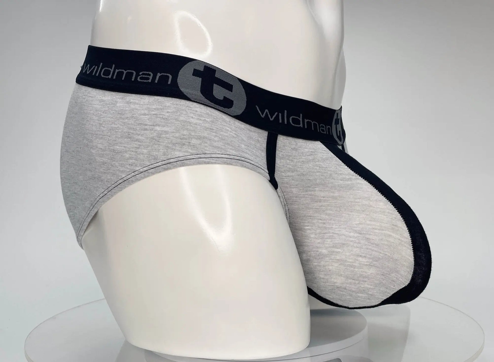 Gray heathered cotton briefs with black elastic waistband featuring wildman branding in wildmant cotton monster cock brief black and gray