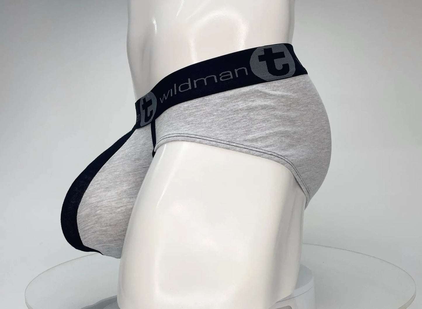 Gray heathered cotton briefs with black elastic waistband featuring wildman brand logo and circular t emblem