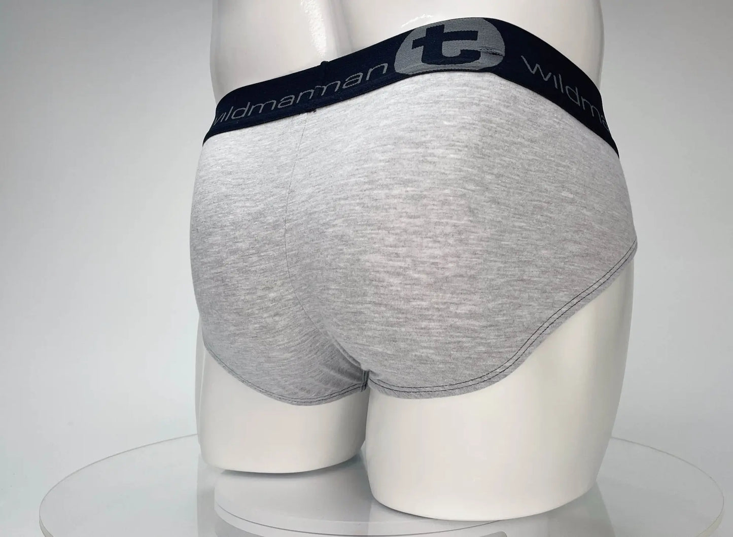 Gray heathered cotton briefs with navy elastic waistband featuring wildman logo from wildmant cotton monster cock brief series