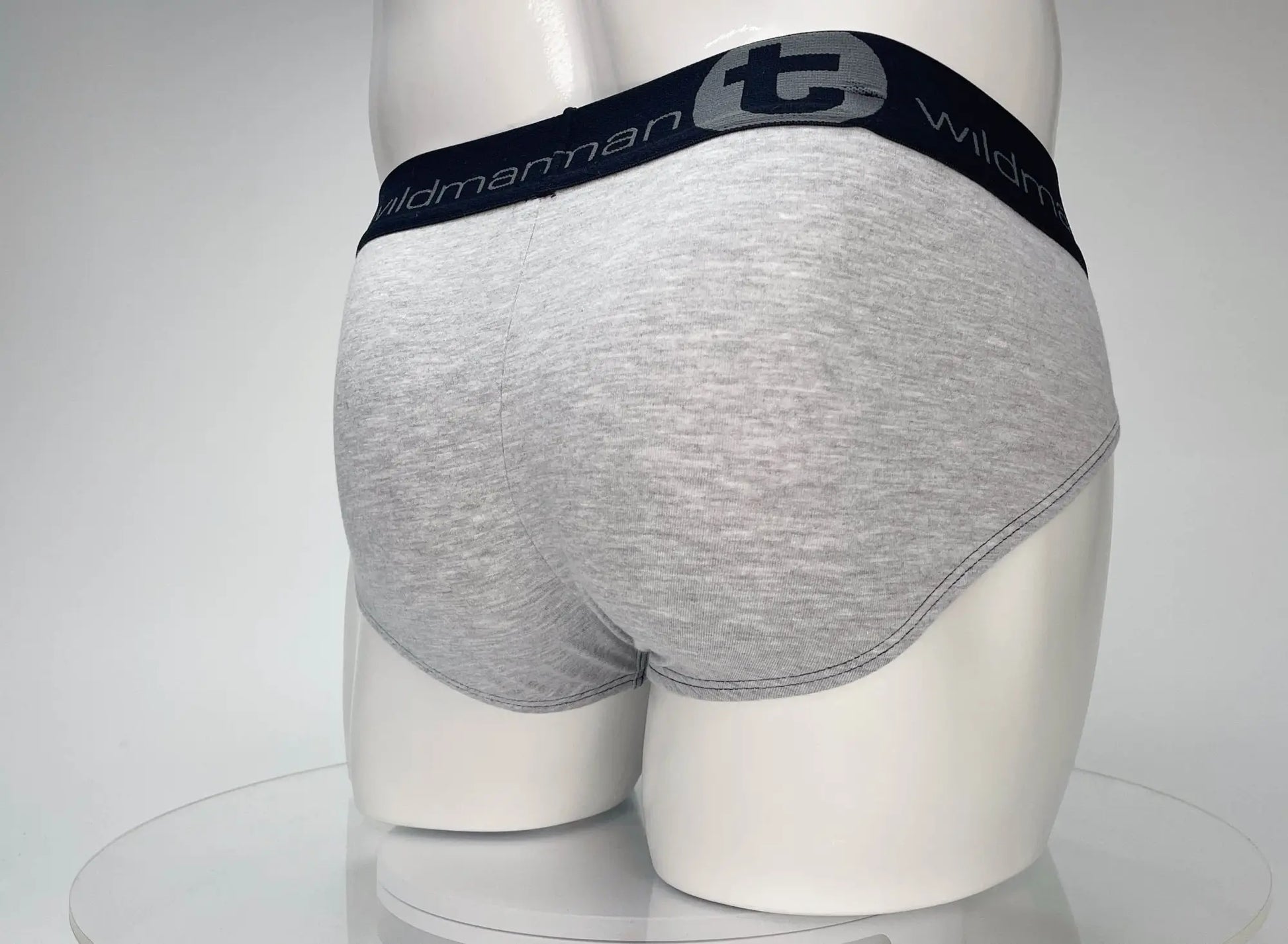 Gray heathered cotton briefs with navy elastic waistband featuring wildman logo from wildmant cotton monster cock brief series