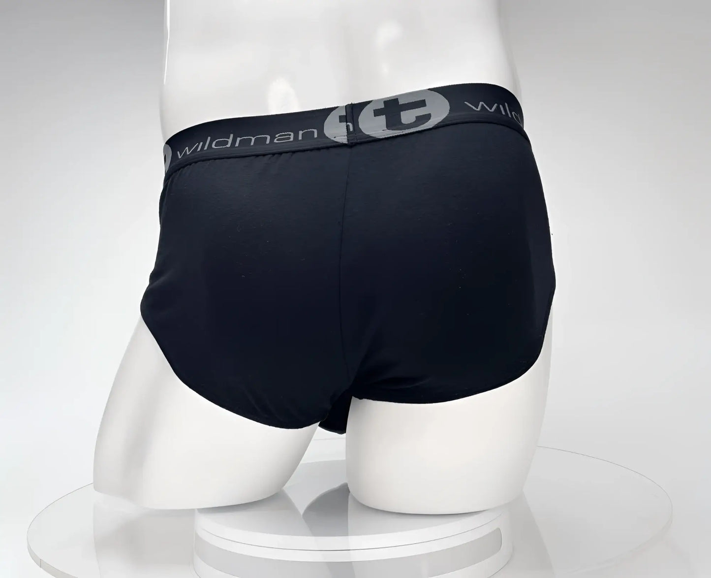 Black wildman briefs with gray elastic waistband featuring WildmanT logo made of cotton for comfortable wear