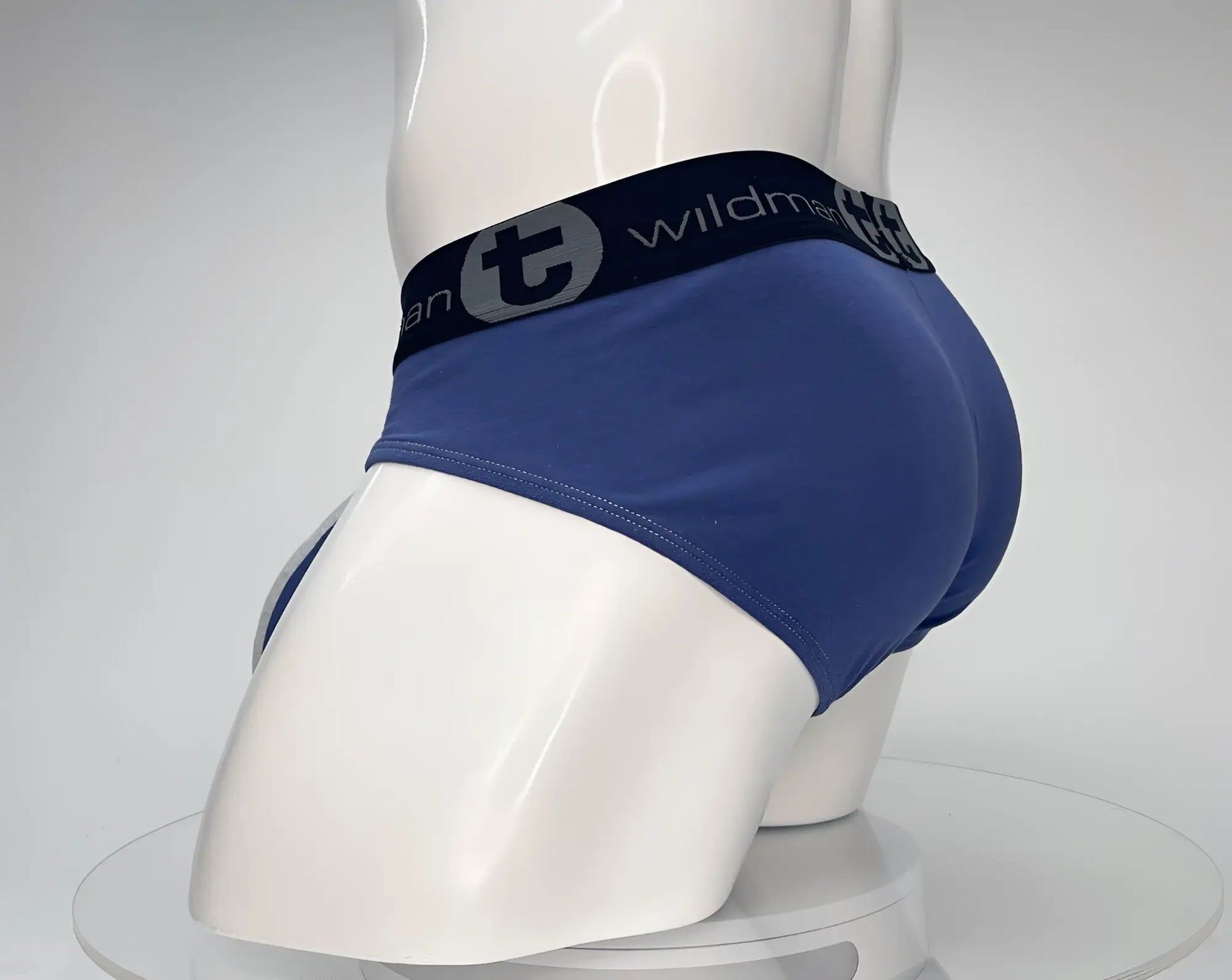 Wildmant cotton monster cock brief in dark blue with black waistband and stylized t emblem in gray