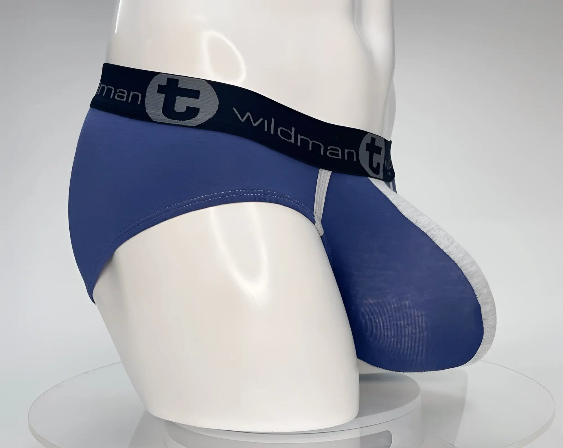 WildmanT cotton monster cock brief in dark blue with gray trim and black waistband featuring wildman logo