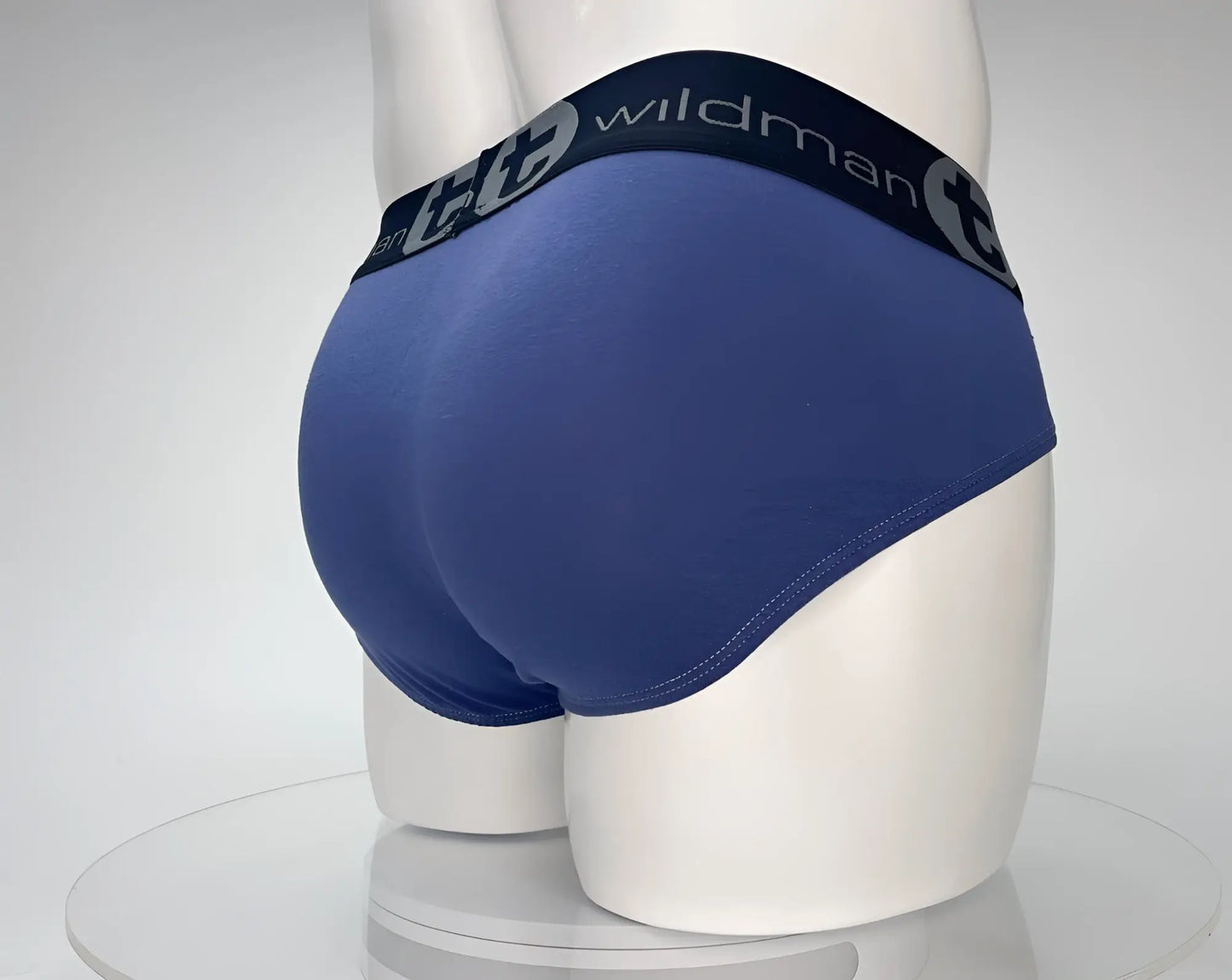 Wildmant cotton monster cock brief dark blue with gray, featuring black elastic waistband with wildman logo and circular t emblem