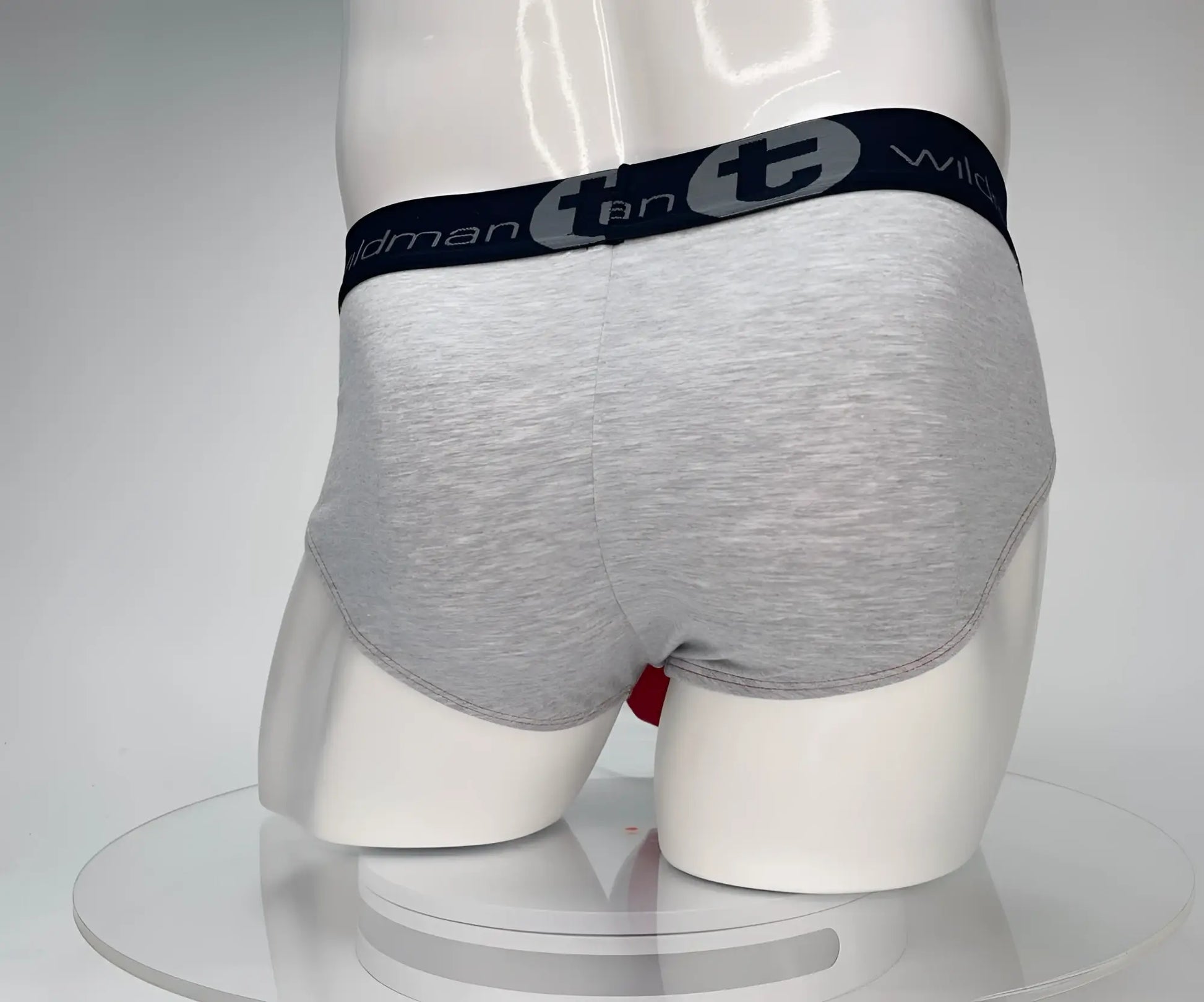 Gray heathered cotton briefs with black elastic waistband featuring wildmant and t logo from wildmant cotton monster cock brief red and gray