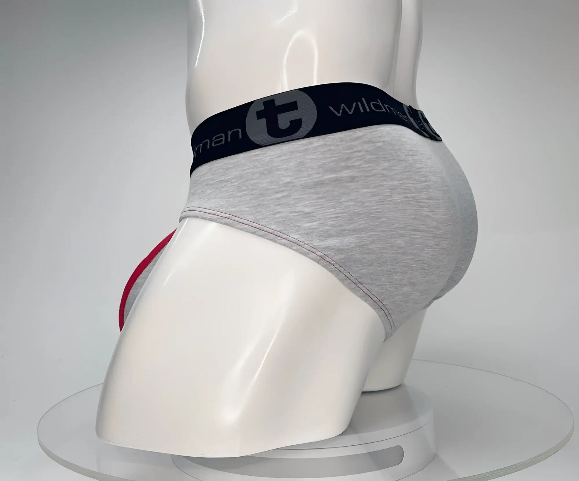 Wildmant cotton monster cock brief in gray heathered fabric with black waistband logo and red side trim