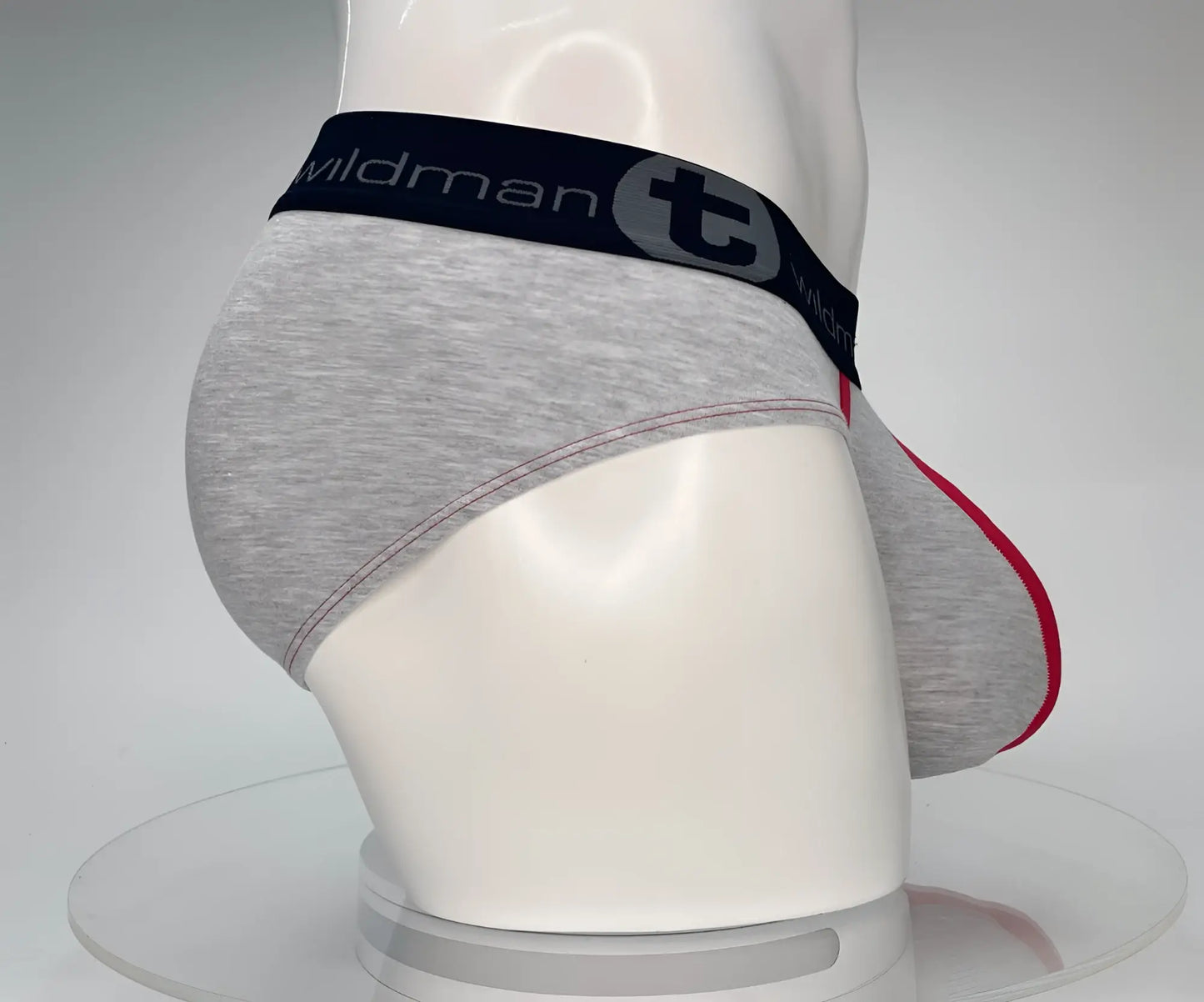 Wildmant cotton monster cock brief in gray heathered cotton with black waistband and red trim on leg openings