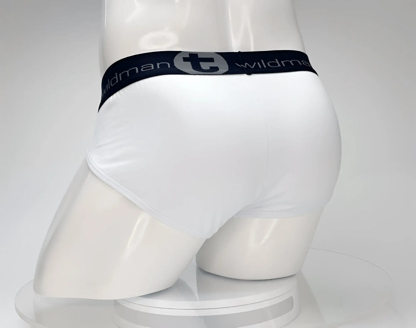 White cotton briefs with a black elastic waistband featuring the wildman brand logo wildmant cotton monster cock brief white