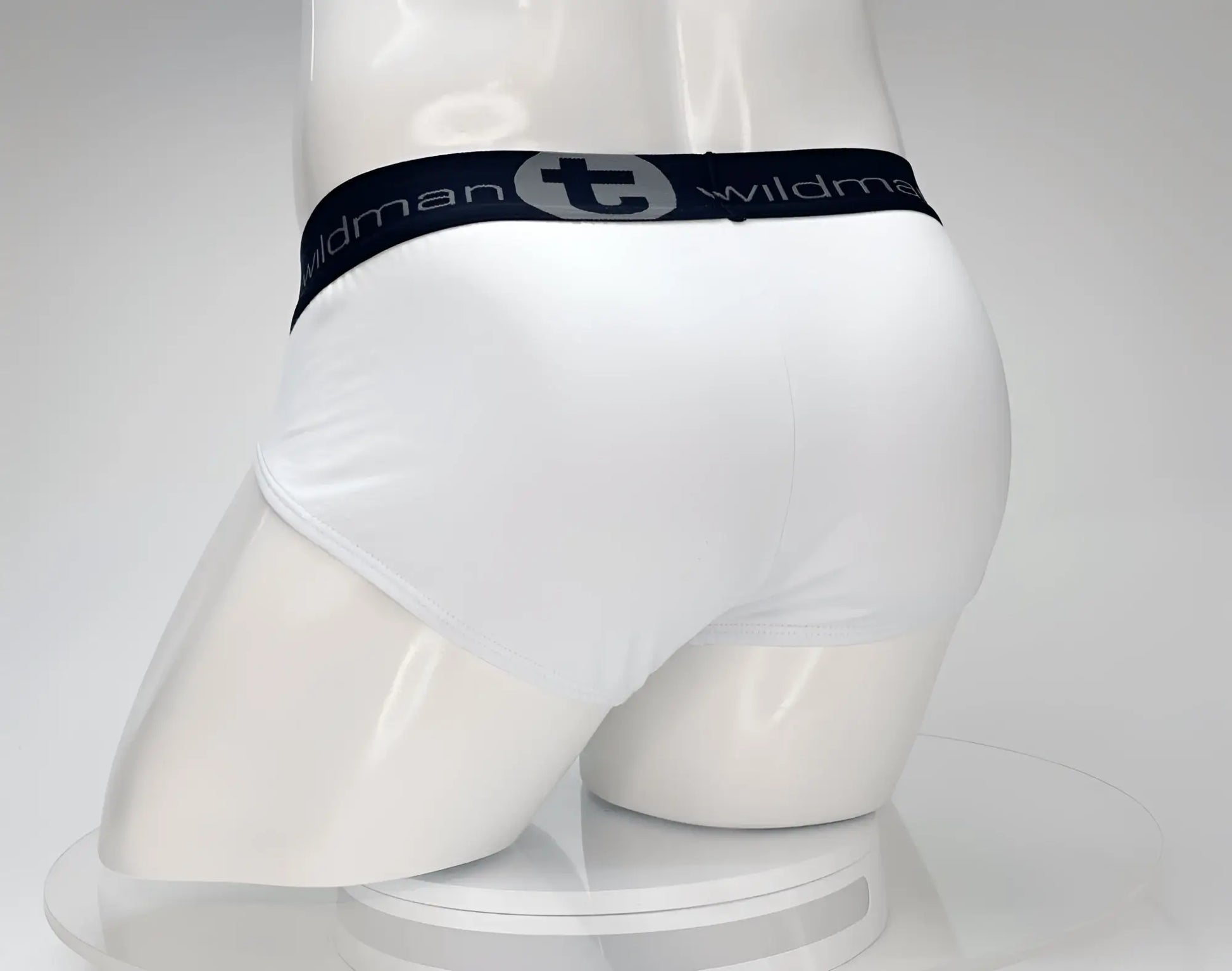 White cotton briefs with a black elastic waistband featuring the wildman brand logo wildmant cotton monster cock brief white