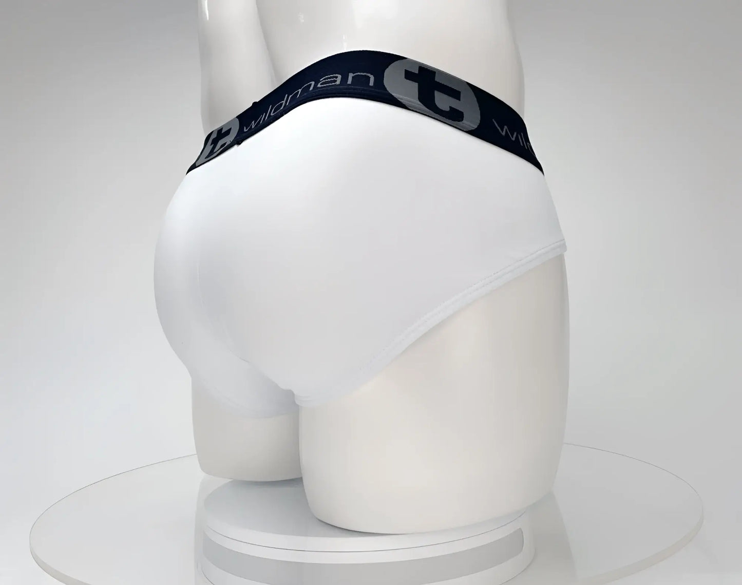 White cotton wildmant cotton monster cock brief with black waistband and silver wildman logo and emblem