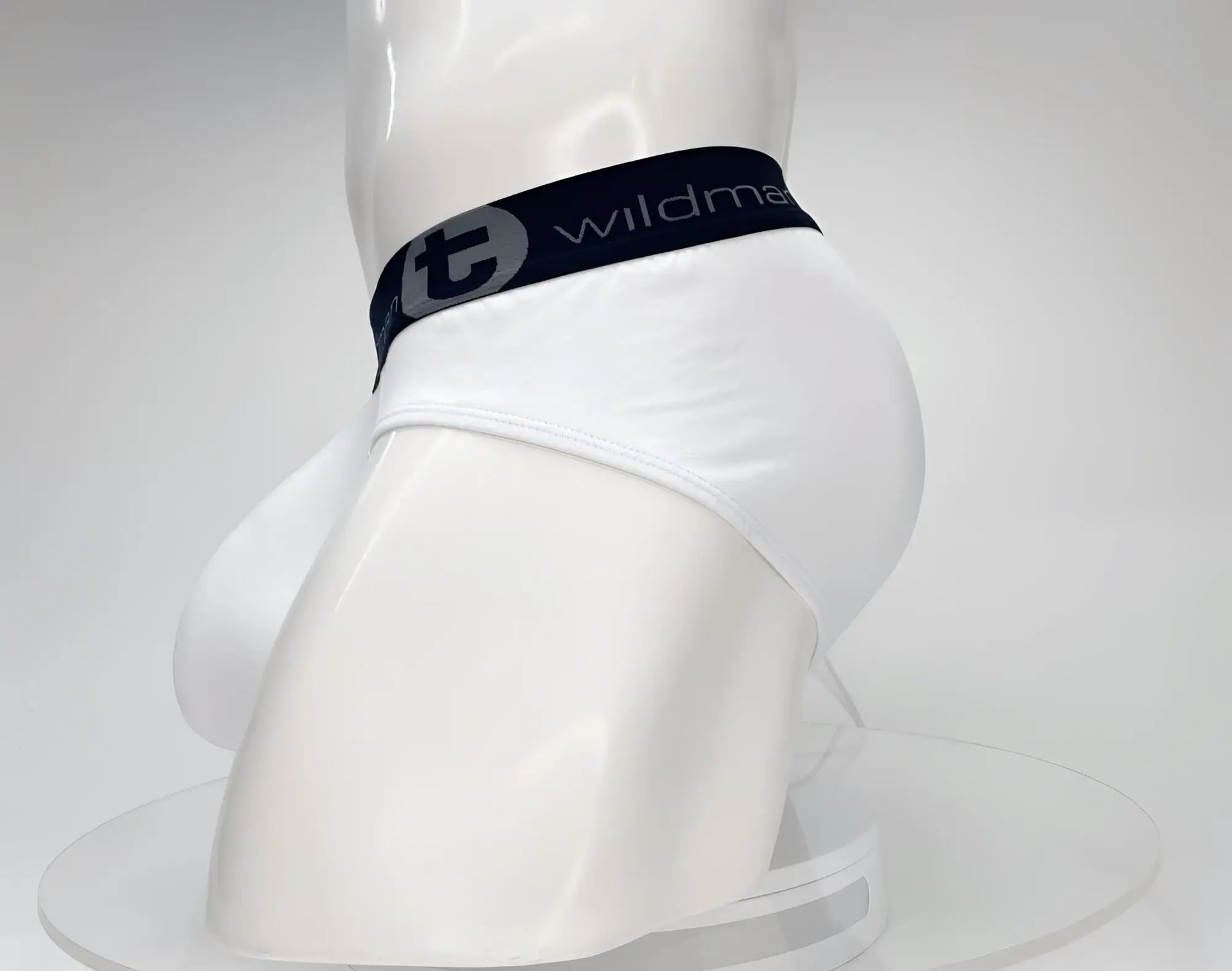 White cotton briefs with black elastic waistband featuring wildman logo and stylized t emblem wildmant cotton monster cock brief
