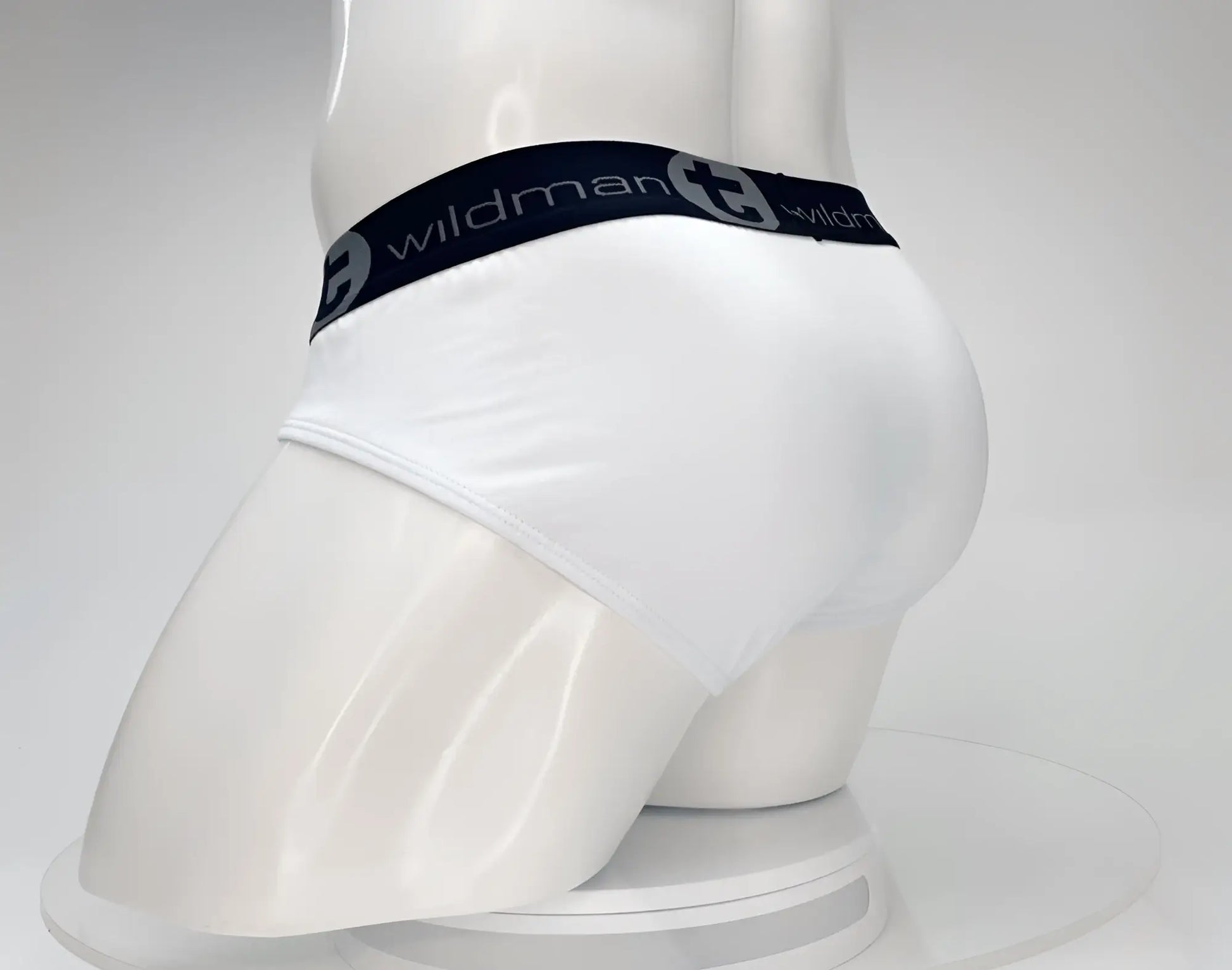 White men’s cotton briefs with black elastic waistband featuring wildman brand logo wildmantec monster cock brief white