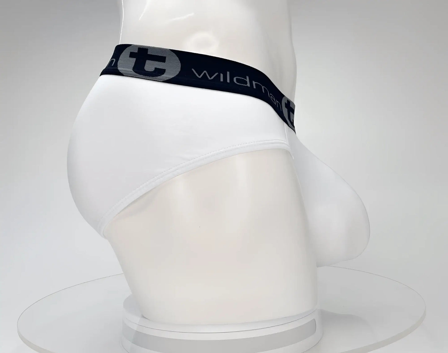 White wildman cotton briefs with black elastic waistband and gray lettering featuring the wildman brand logo