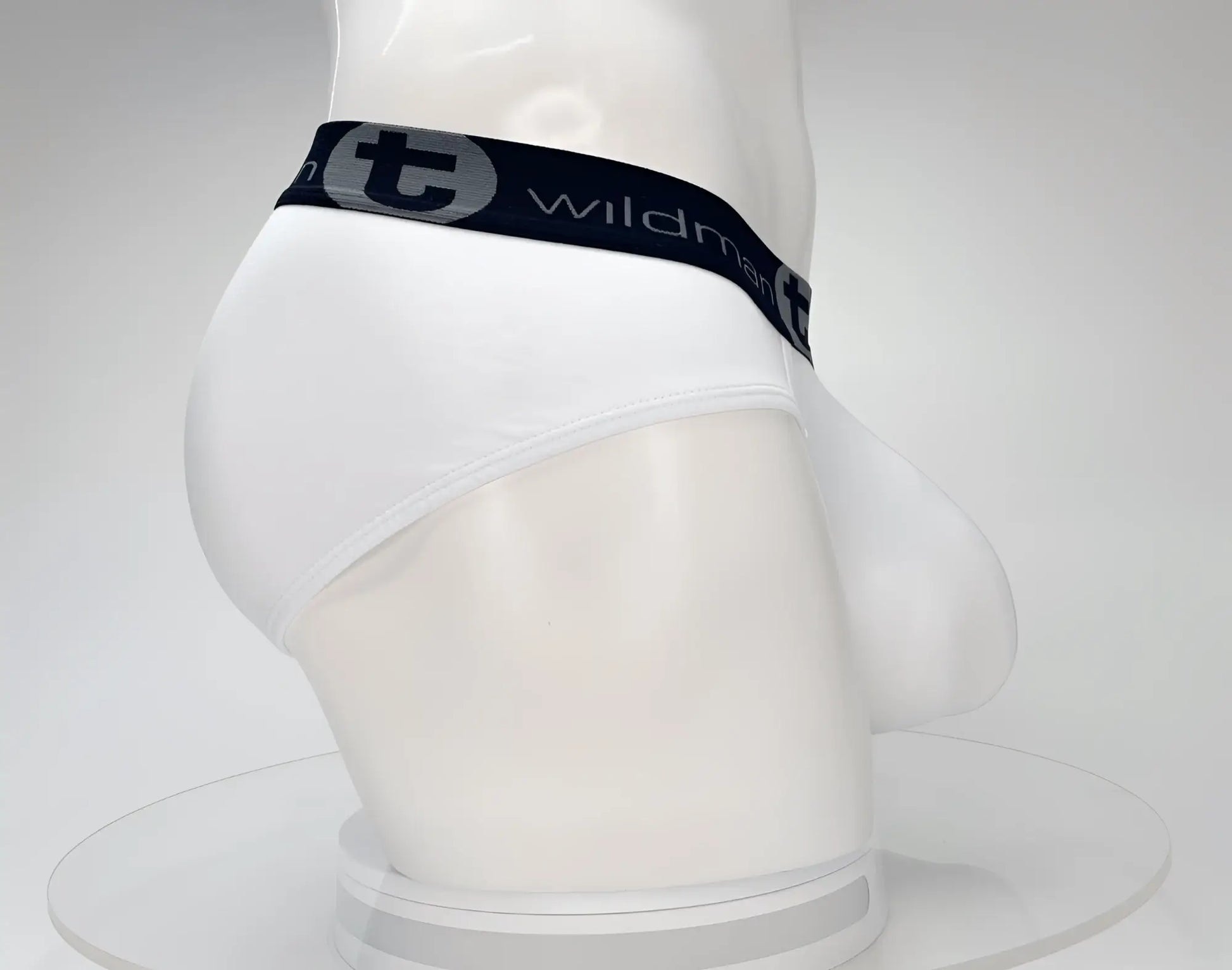 White wildman cotton briefs with black elastic waistband and gray lettering featuring the wildman brand logo