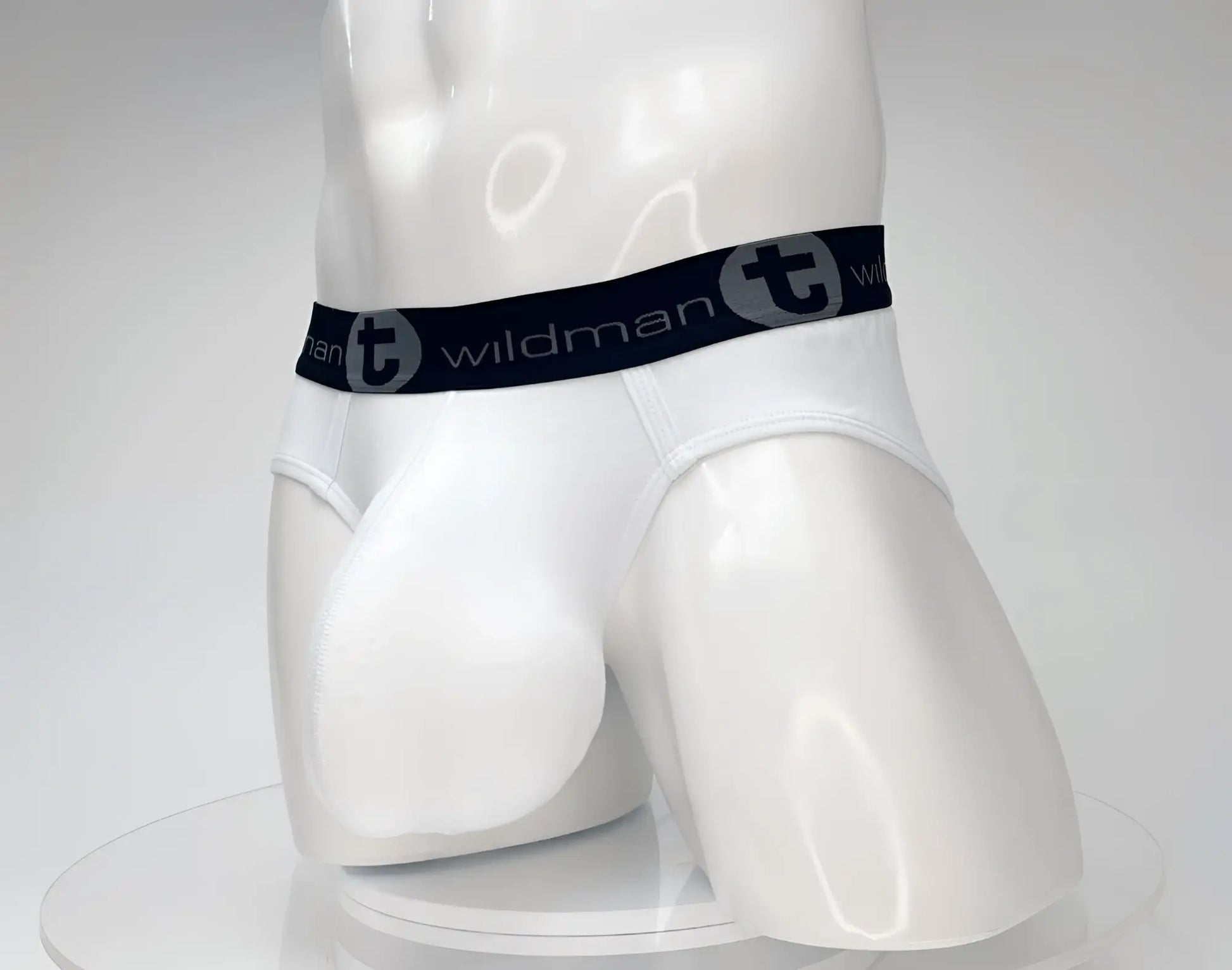 White wildmant cotton monster cock brief with black elastic waistband and gray wildman logo lettering