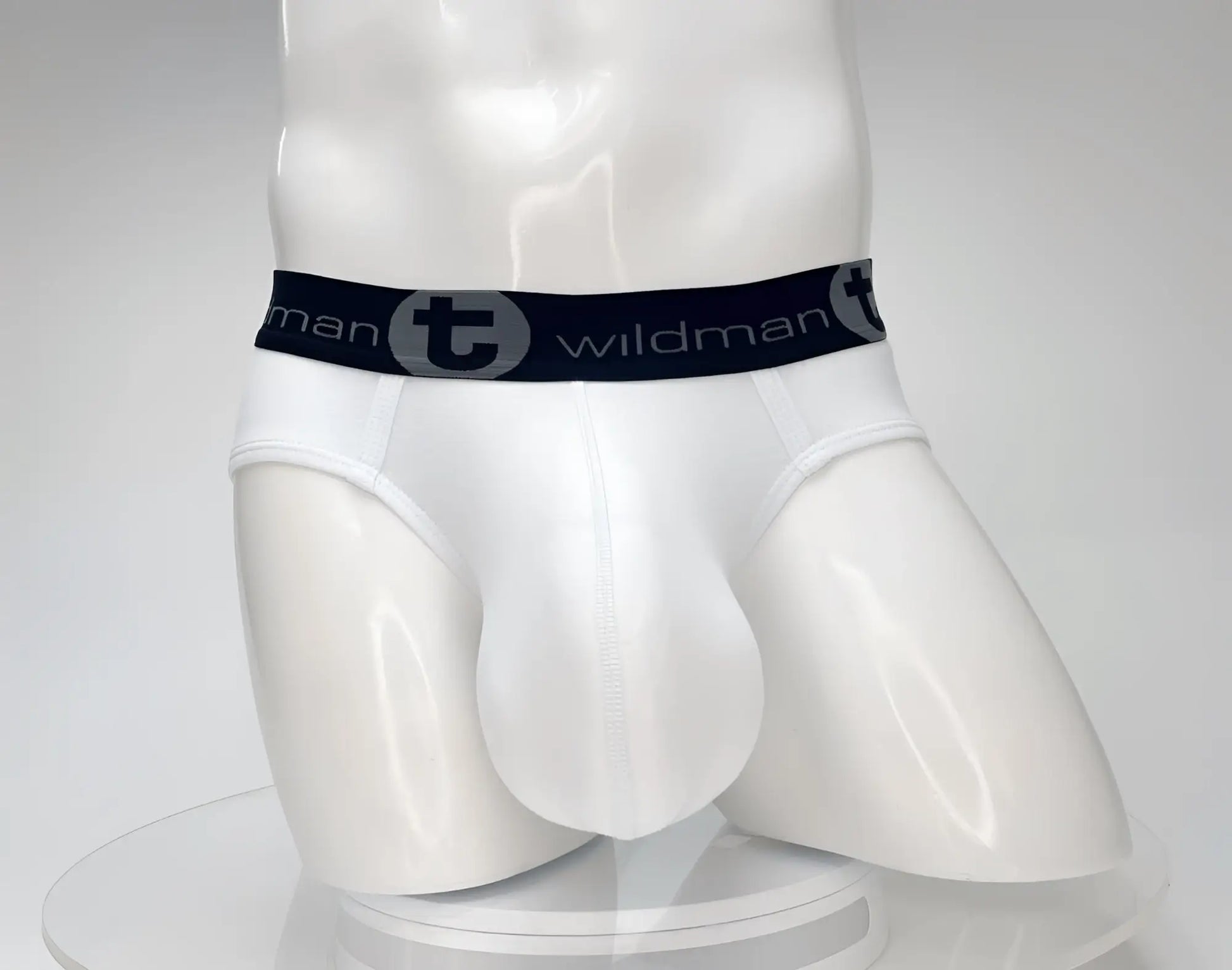 White men’s cotton briefs with black elastic waistband featuring wildman brand logo from wildmant cotton monster cock brief white