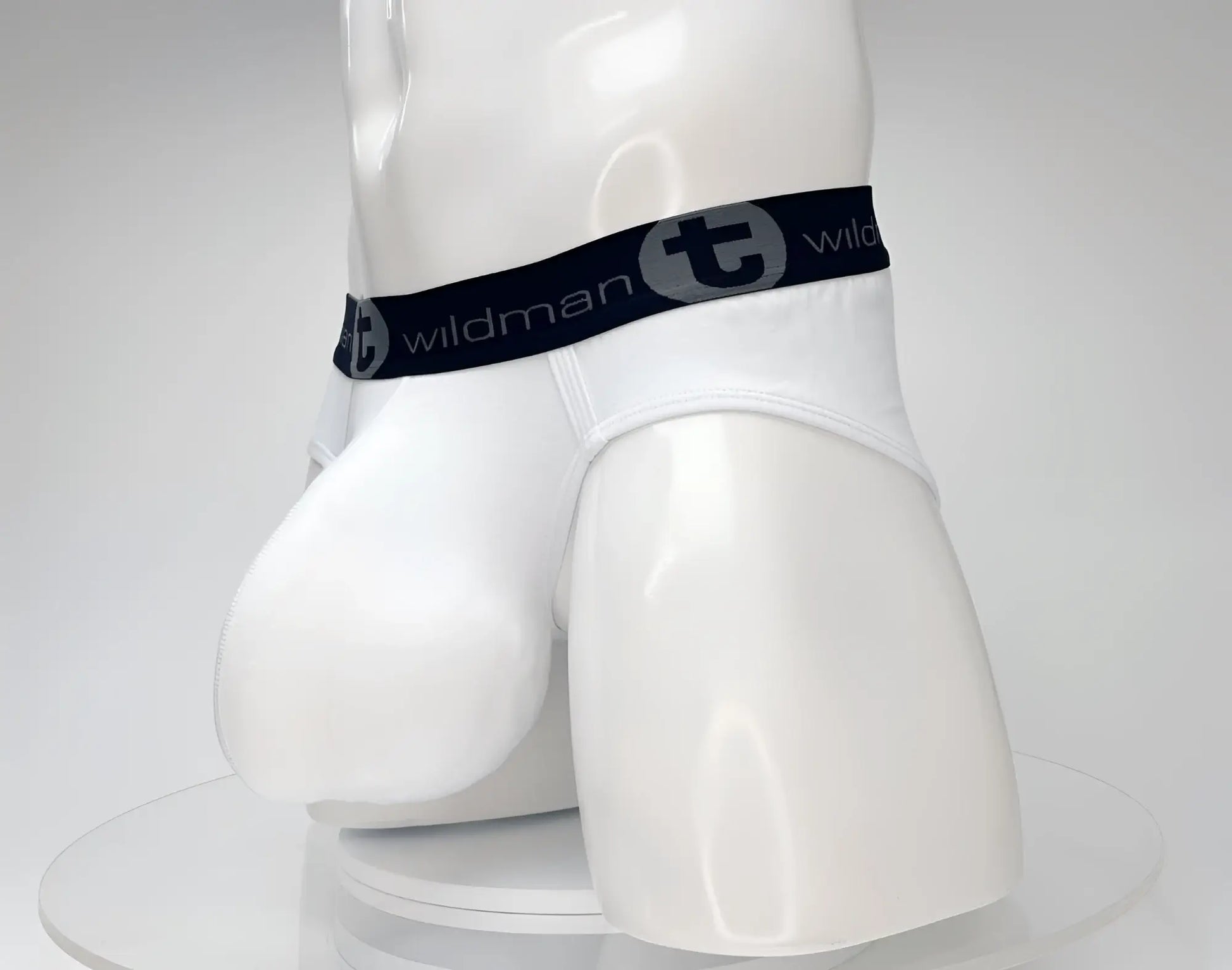 White wildmanT cotton monster cock brief with black elastic waistband featuring wildman logo and gray lettering