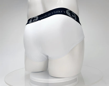 White wildman briefs made of cotton with a black elastic waistband featuring the brand logo and lettering