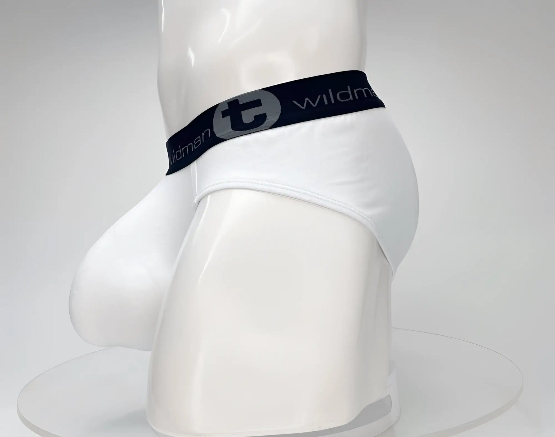 White wildman cotton briefs with black elastic waistband featuring t logo and brand name in gray wildmant cotton monster cock brief white