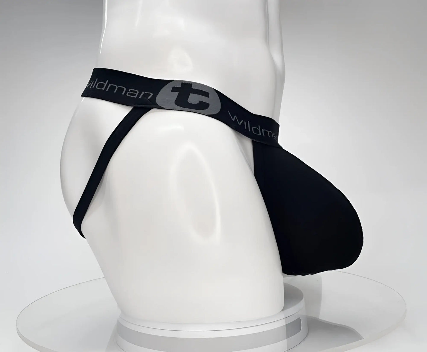WildmanT cotton monster cock jockstrap in black with gray logo and elastic waistband showing front view