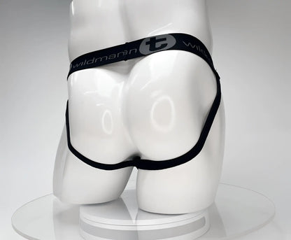 Black WildmanT jockstrap on a white mannequin, featuring branded elastic waistband with a "T" logo.