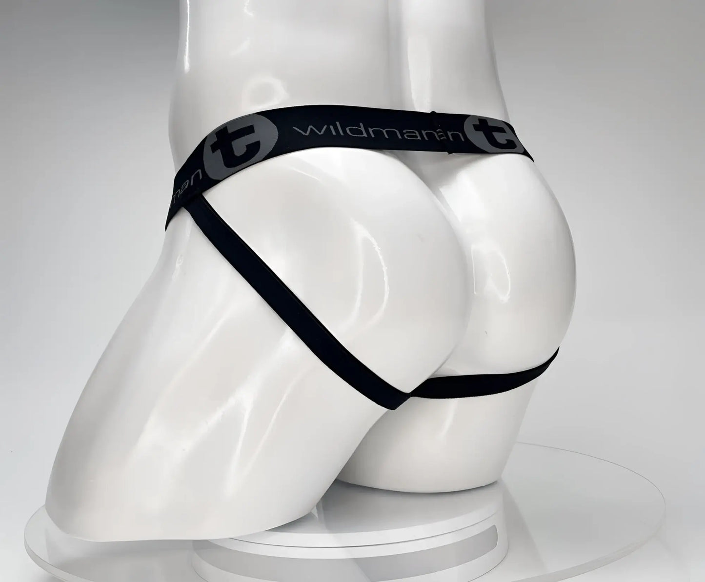 Black wildmanT cotton monster cock jockstrap thong with elastic waistband and side straps shown from back side