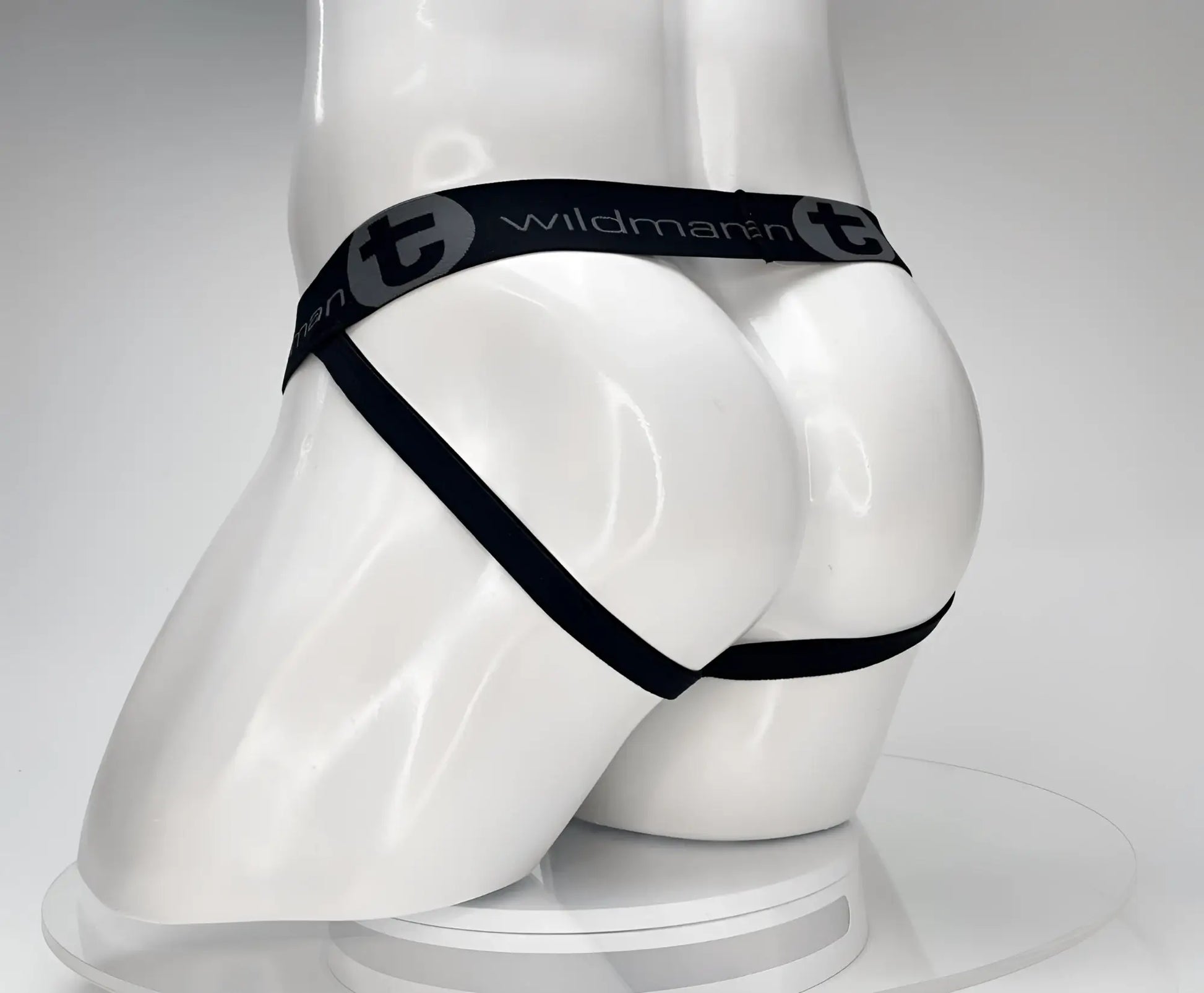 Black wildmanT cotton monster cock jockstrap thong with elastic waistband and side straps shown from back side