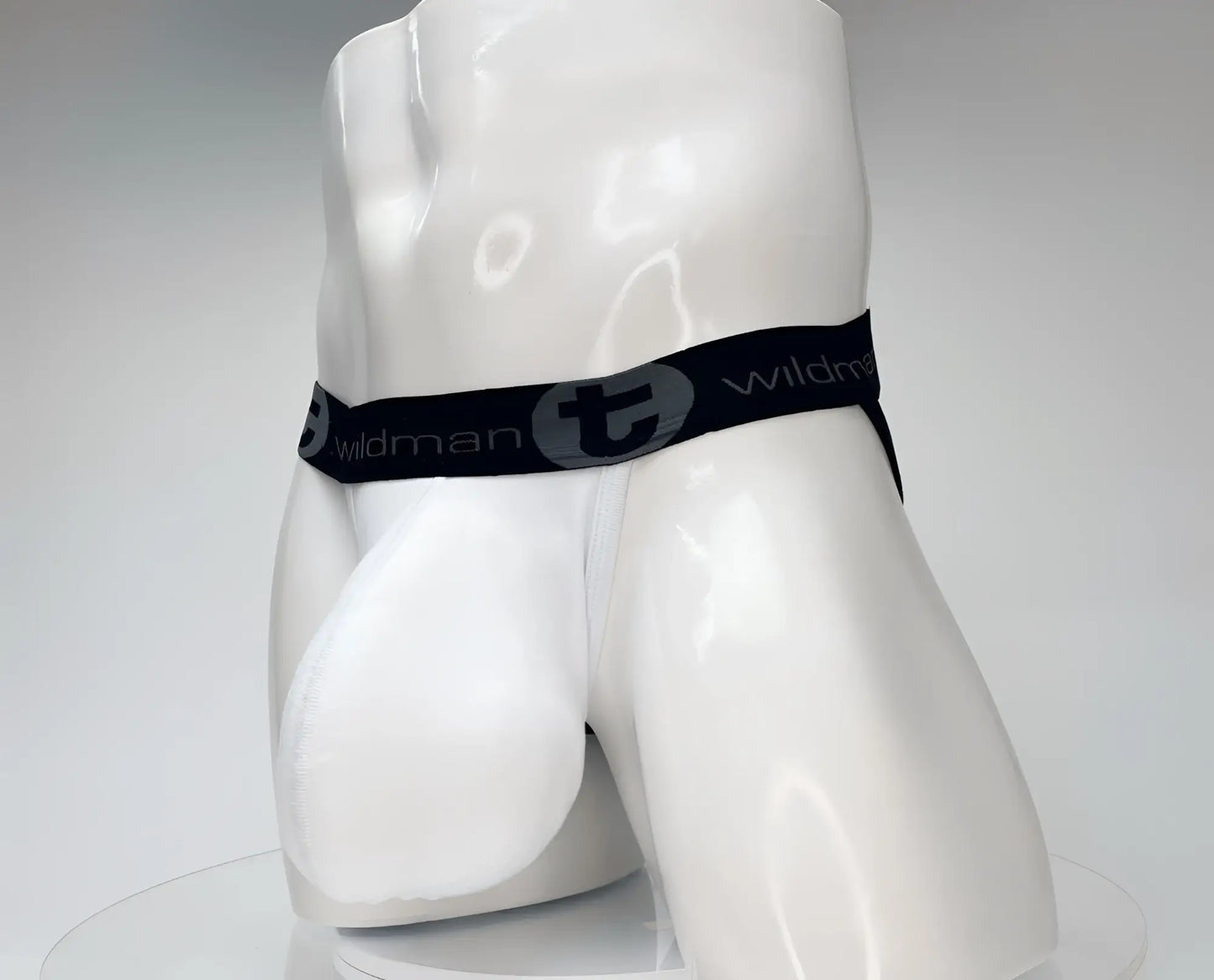 Wildmant cotton monster cock jockstrap white with black elastic waistband and wildman branding on white mannequin