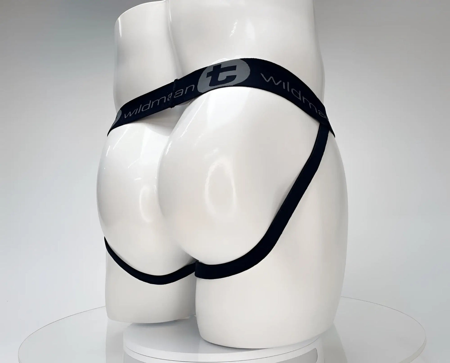 Black elastic waistband briefs with wildman branding and stylized t logo in wildmant cotton monster cock jockstrap white