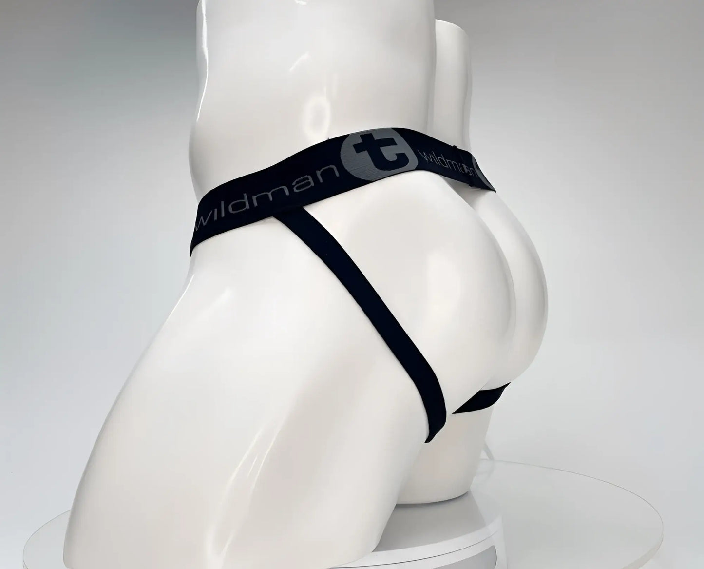 Black wildman brand cotton jockstrap with sleek minimalist design elastic waistband shown from back side