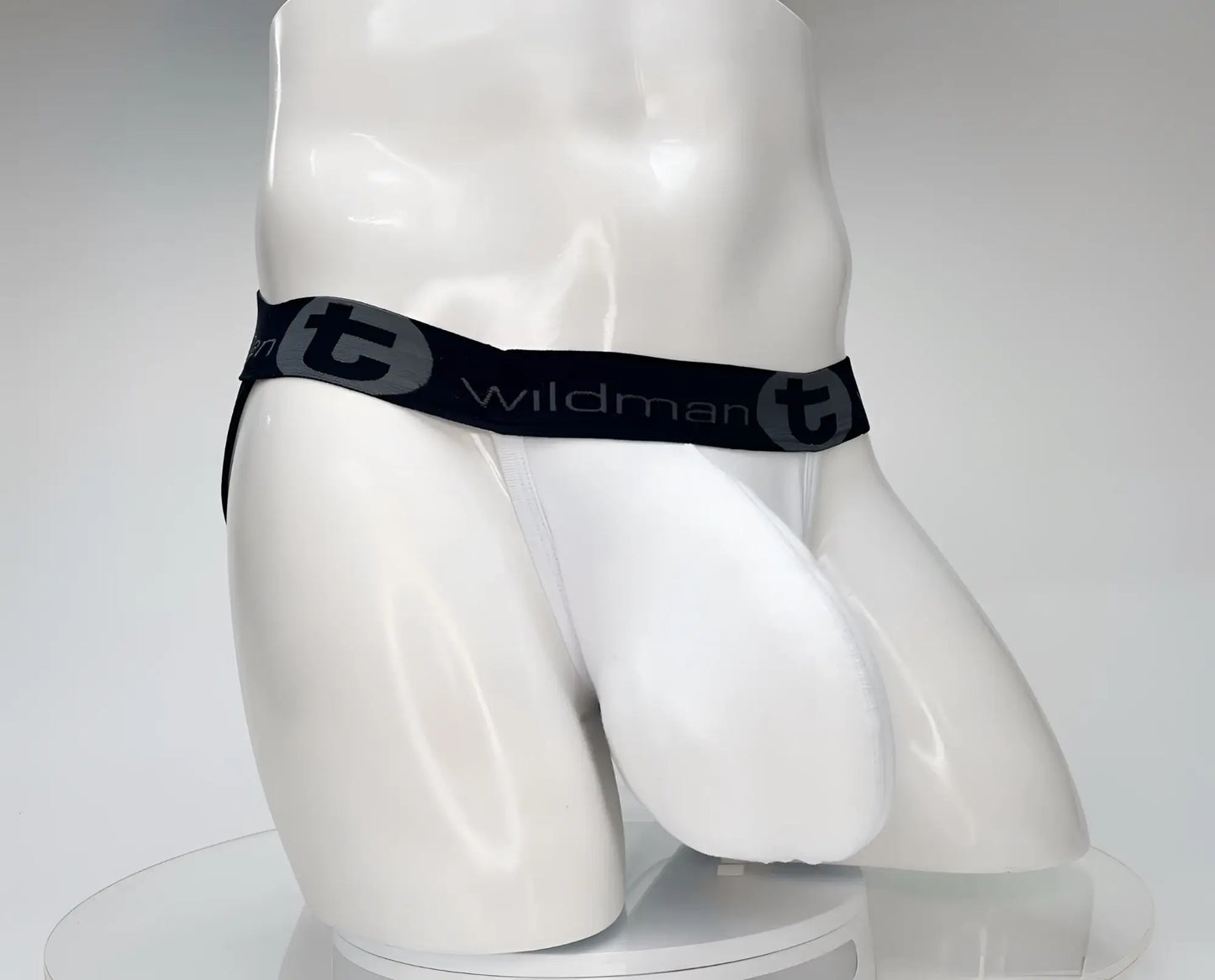 White wildman cotton monster cock jockstrap briefs with black waistband and gray wildman t logo and brand name