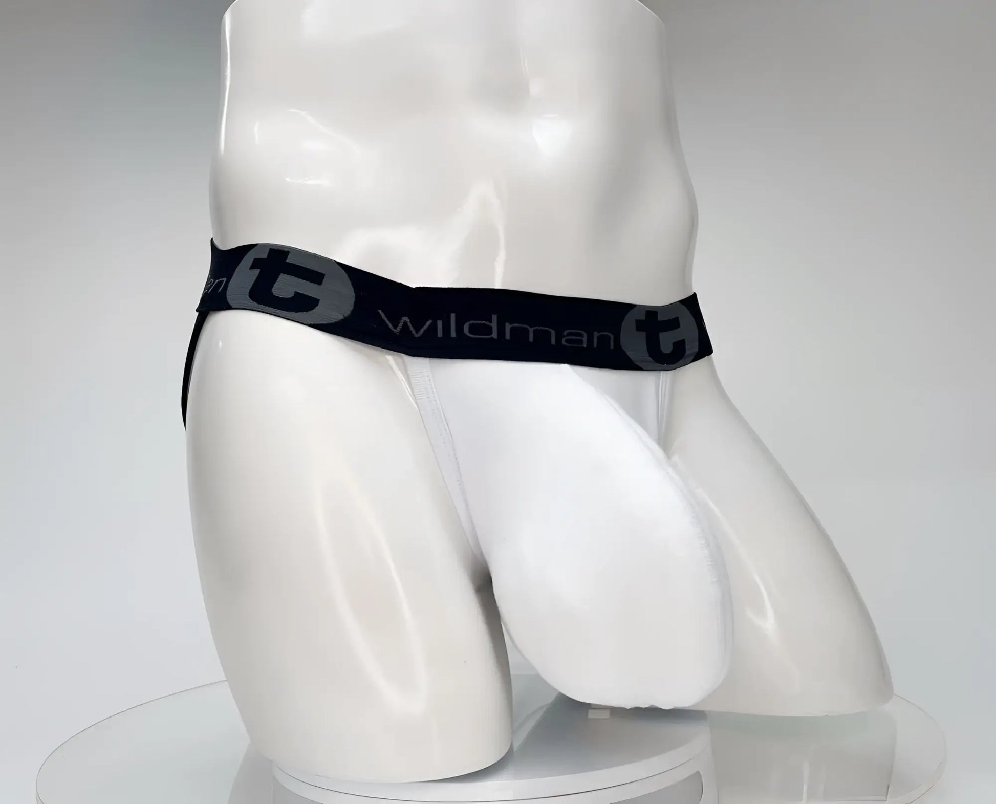 White wildman cotton monster cock jockstrap briefs with black waistband and gray wildman t logo and brand name