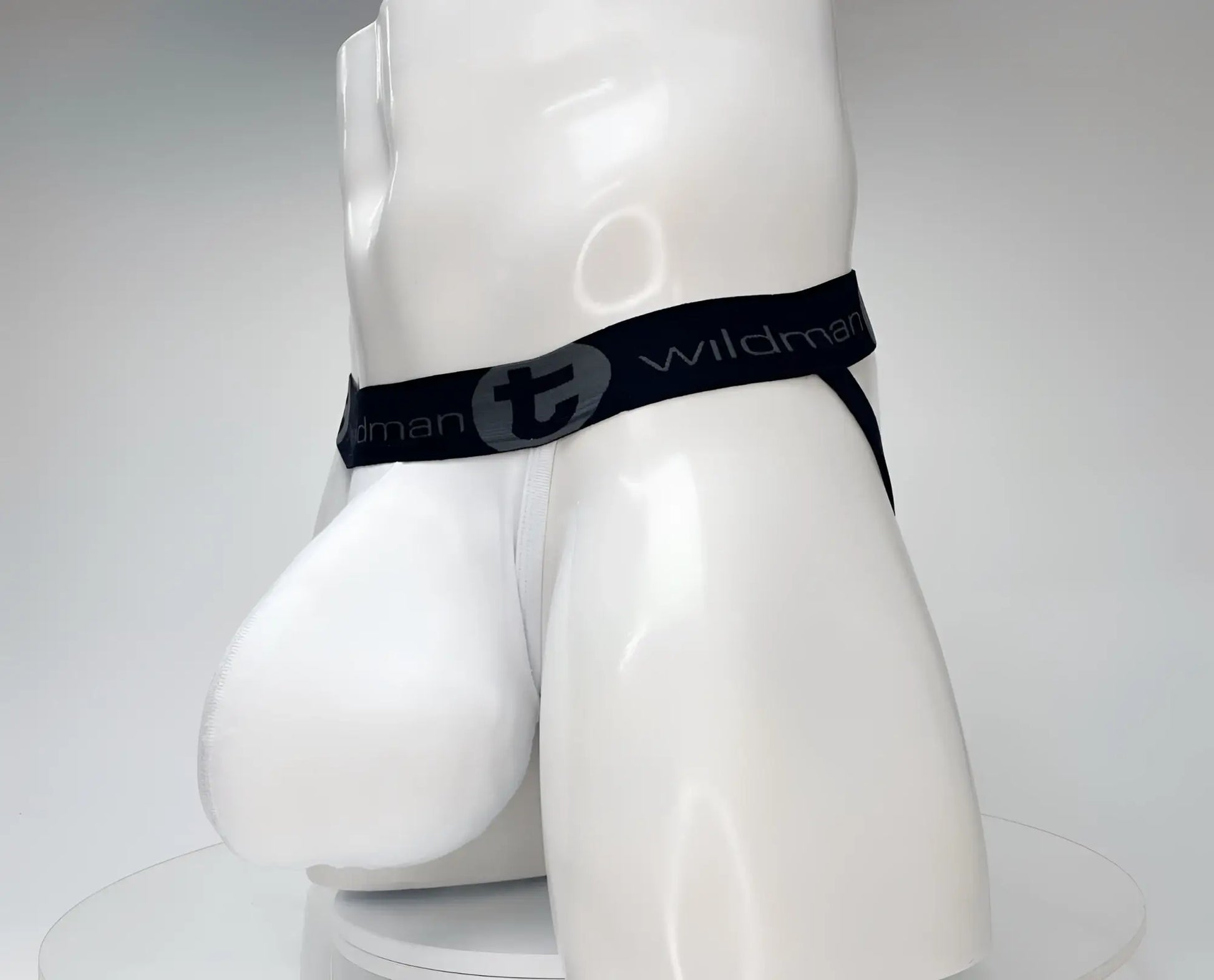White wildman cotton briefs with black elastic waistband featuring gray wildman logo from wildmant cotton monster cock jockstrap white